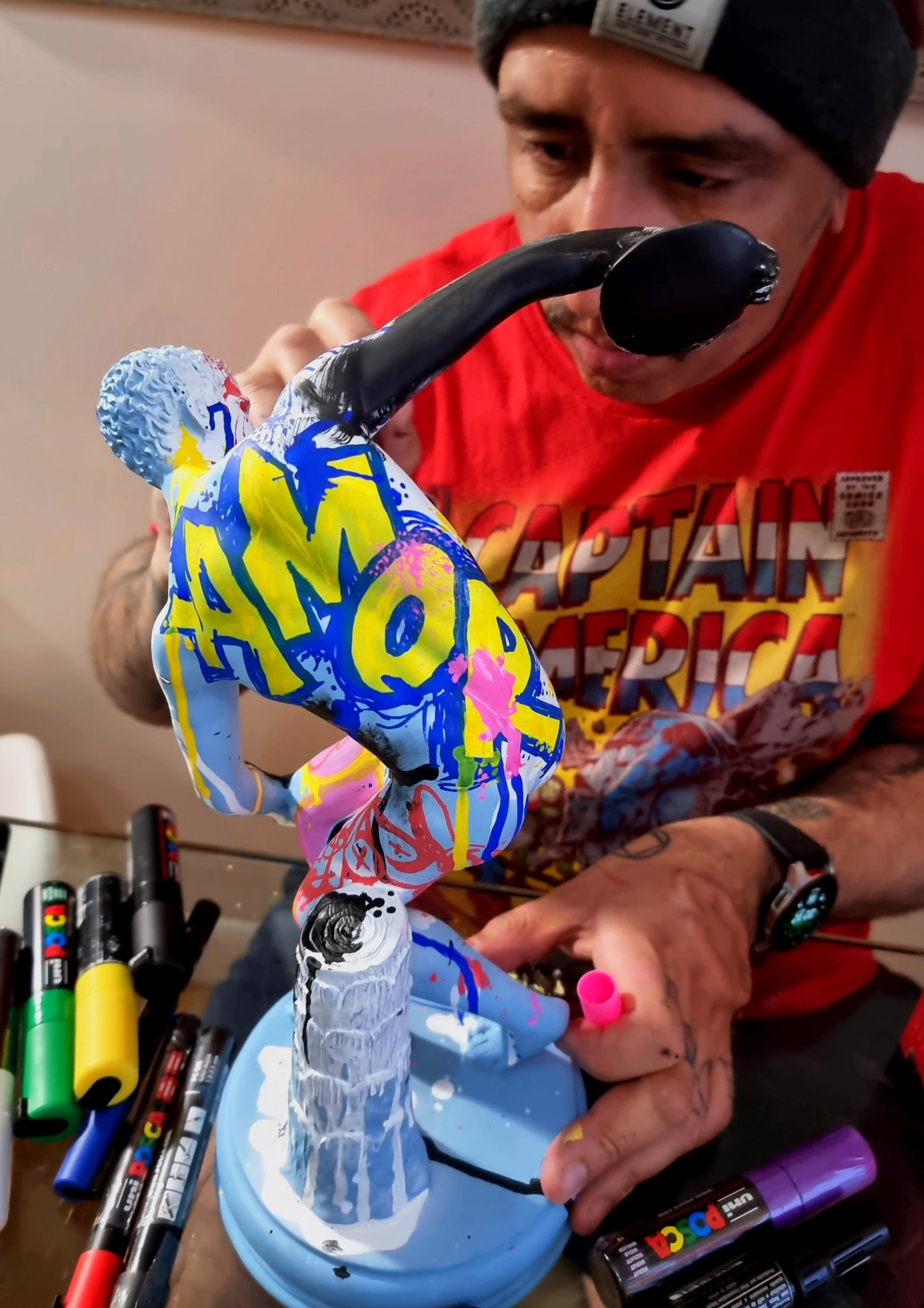 André Fila painting a sculptural object