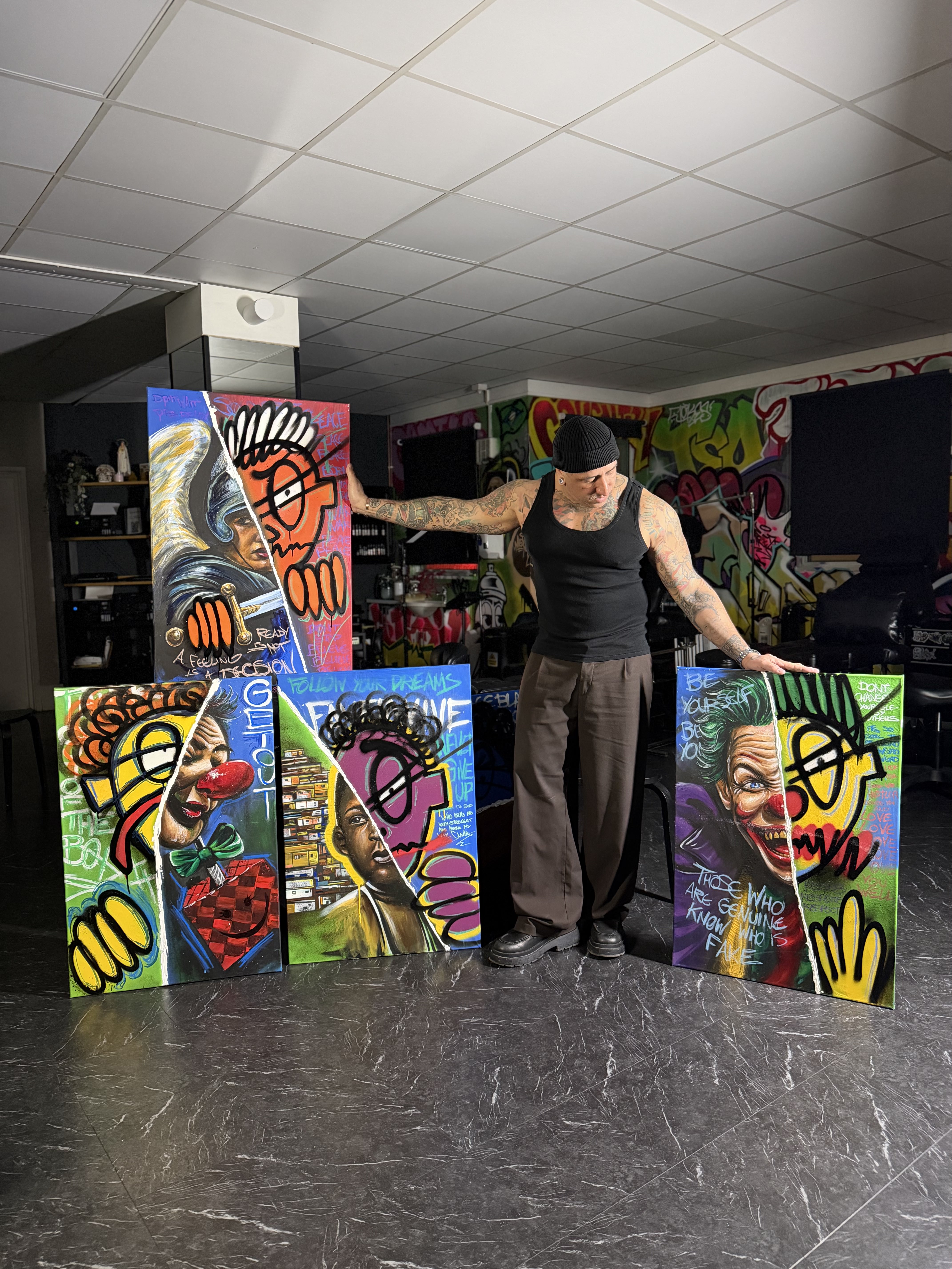 André Fila with a canvas in his studio